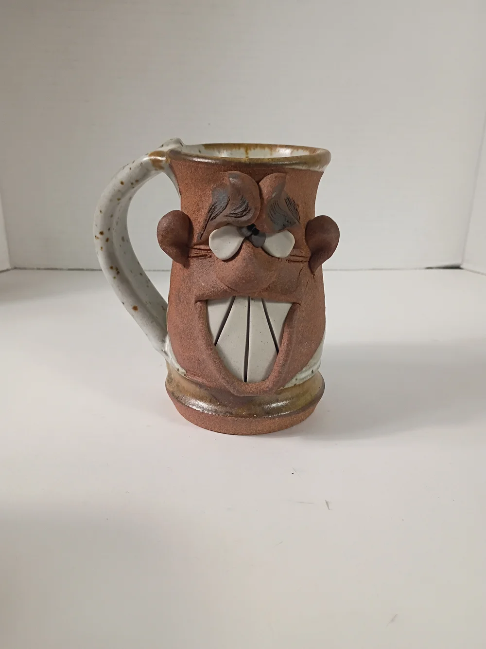 Hand Made pottery-crazy face mug-drunk confused or stoned dude